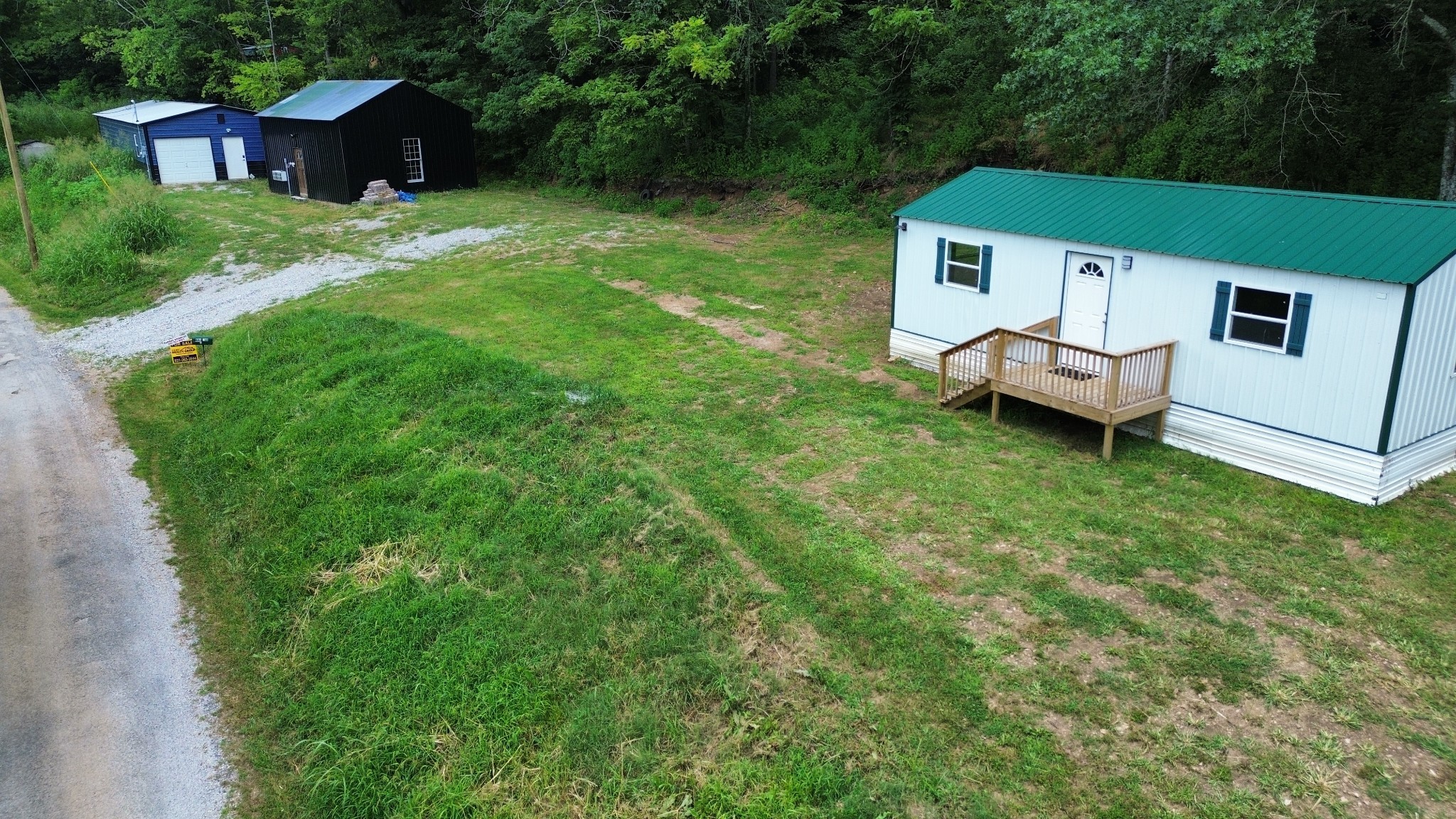 a view of a house with a backyard