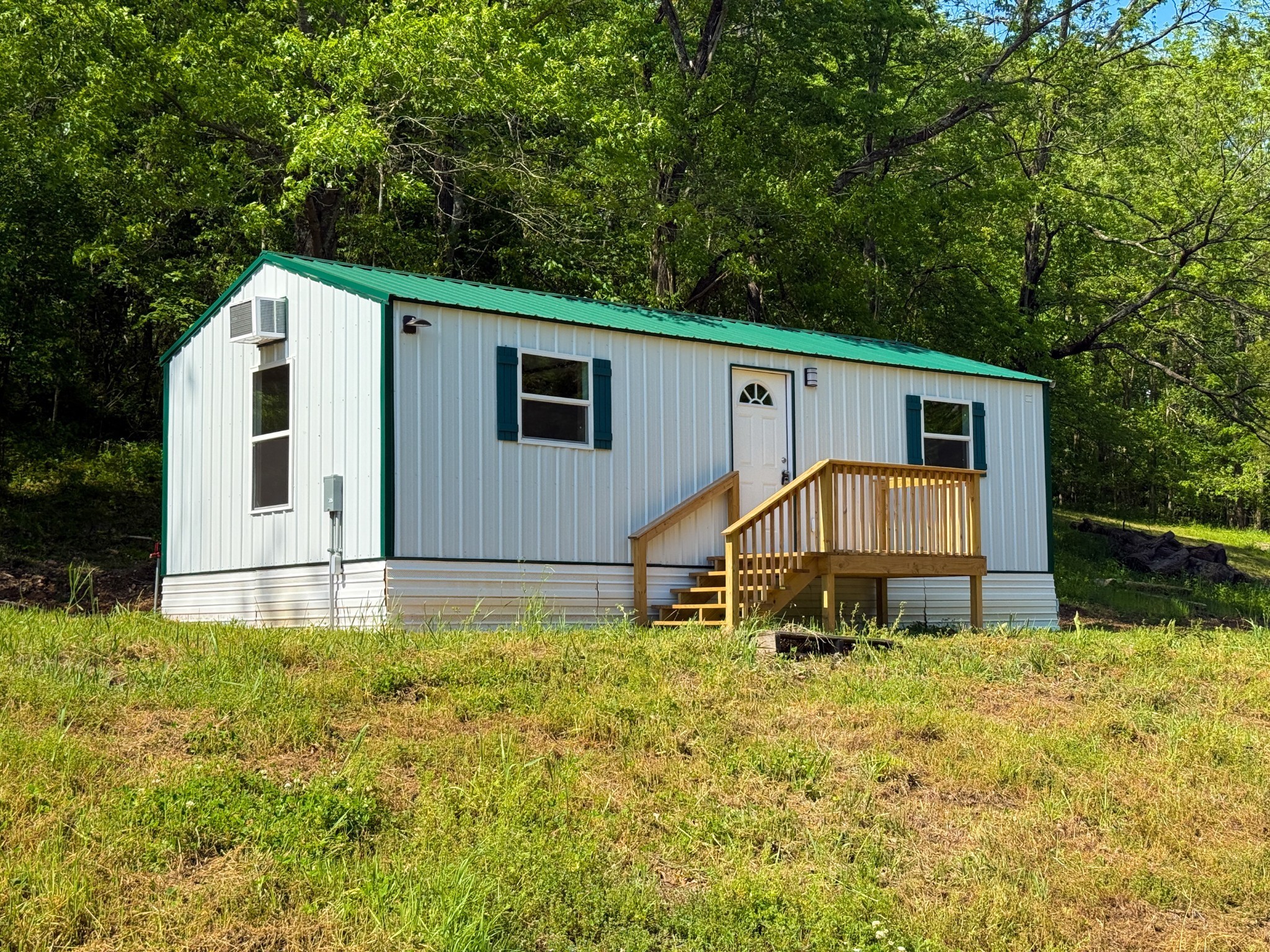 140 Ben Johnson Road Pulaski, TN 38478 - Photo 9 of 44 a backyard of a house with table and chairs