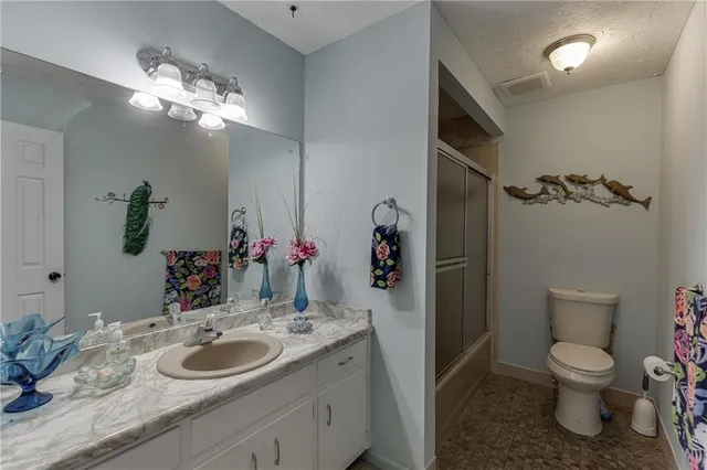 a living room with furniture rug and a window