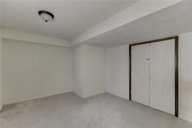 a black and white photo of a refrigerator