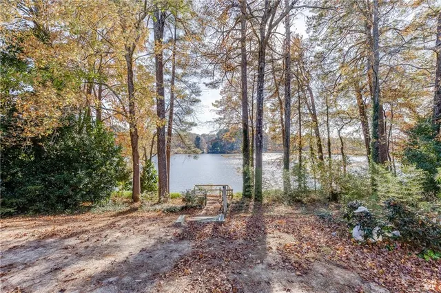 an aerial view of a house with a yard and a garden