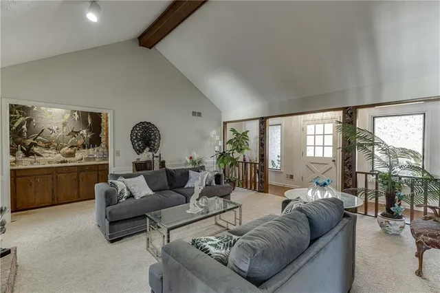 a view of a dining table and chairs in the kitchen and a window