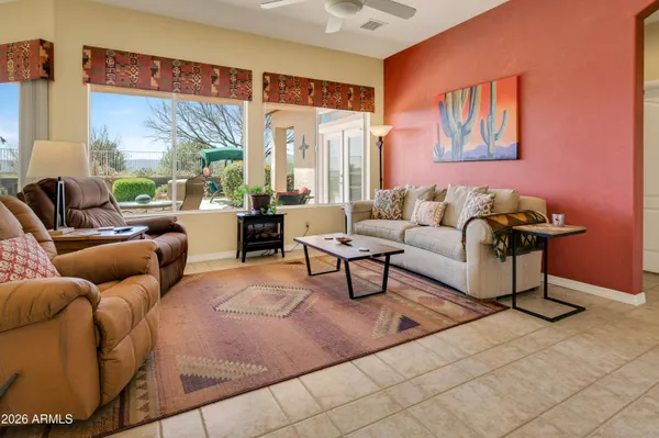 a living room with furniture and a large window