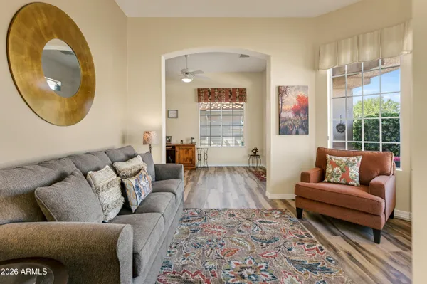 a living room with furniture and a large window
