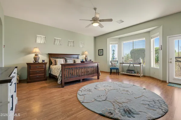 a bedroom with furniture and a bed