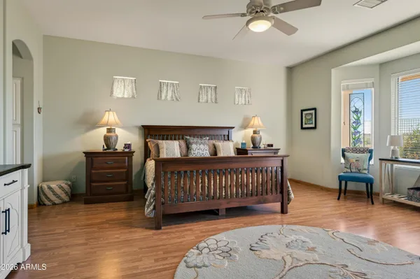 a bedroom with furniture and a window