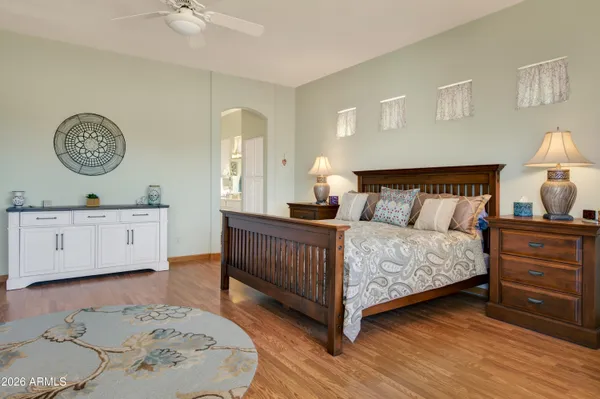 a bedroom with a bed and a table