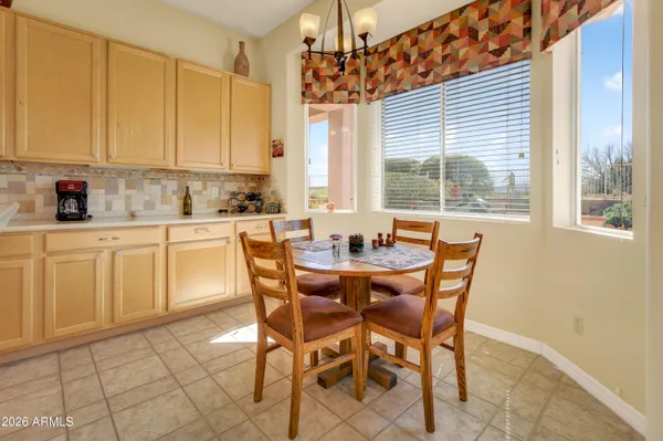a view of a dining room with furniture and window