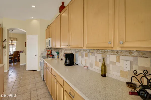 a kitchen with sink and cabinets