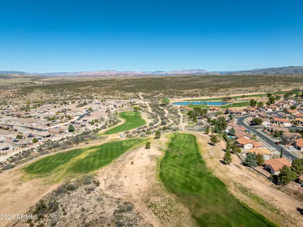 an aerial view of residential building and ocean
