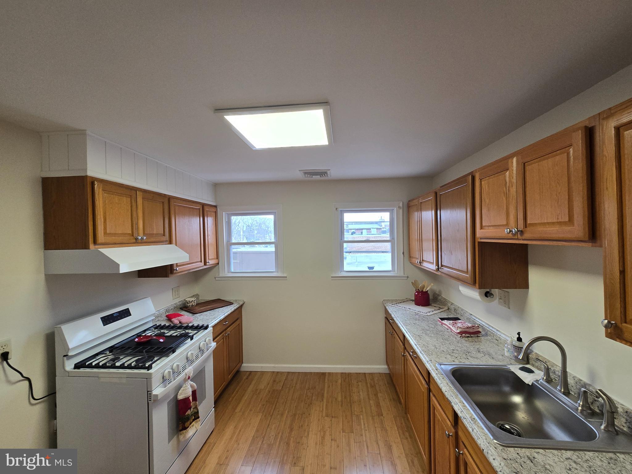 130 South Broadway Pitman, NJ 08071 - Photo 2 of 11 a kitchen that has a sink and a stove