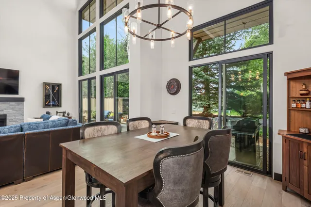 a view of a dining room with furniture window and outside view