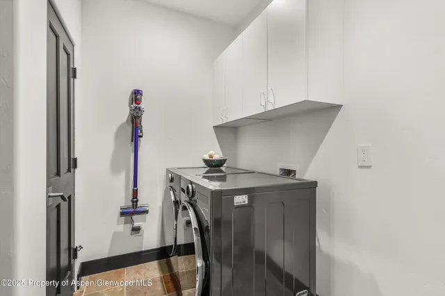 a utility room with washer and dryer