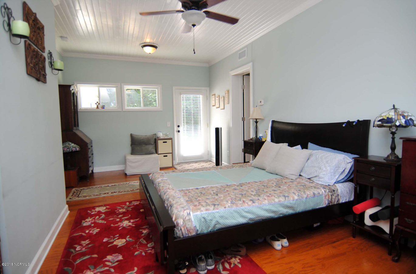22 Partridge Road Wilmington, NC 28412 - Photo 10 of 30 Master Suite behind Family Room provides privacy and opportunity for guest area