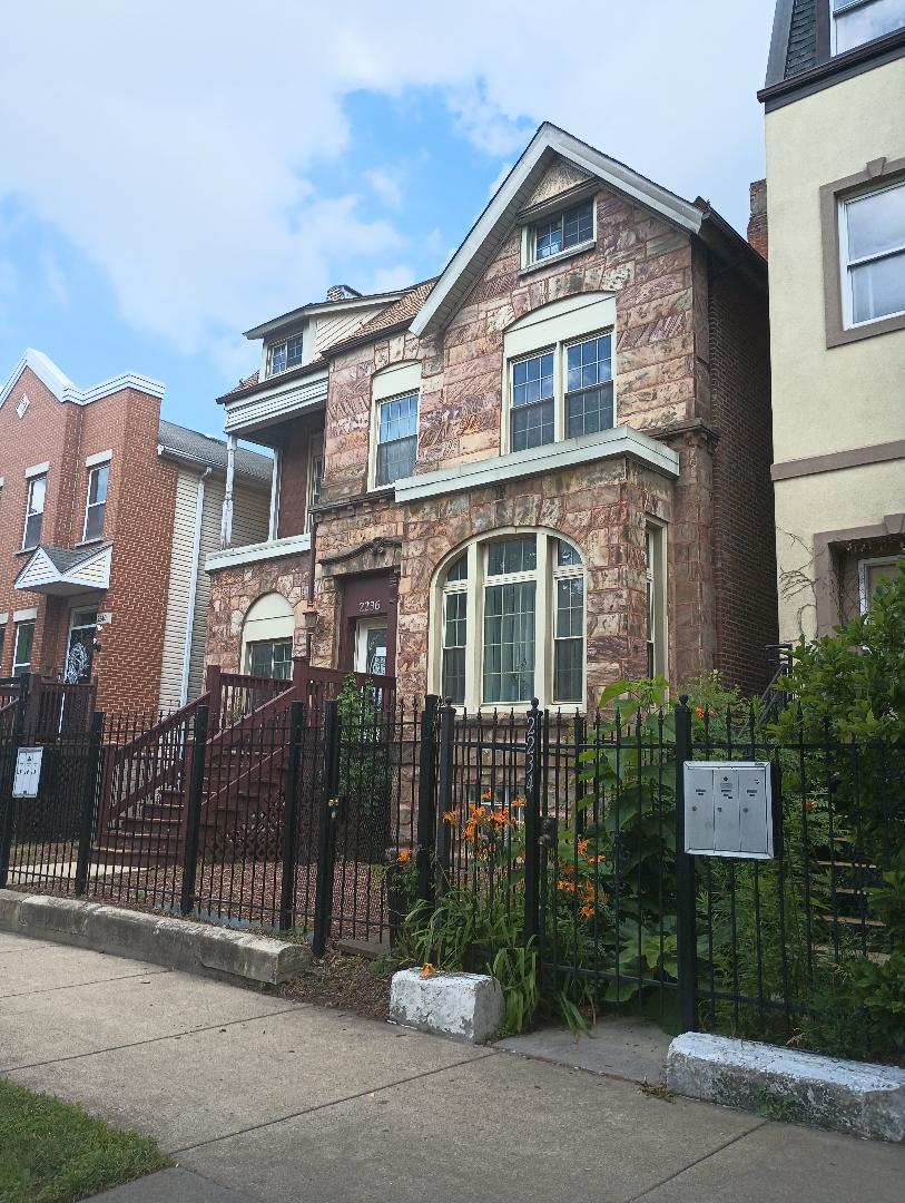2236 West Monroe Street Chicago, IL 60612 - Photo 2 of 36 a front view of a house with a garden