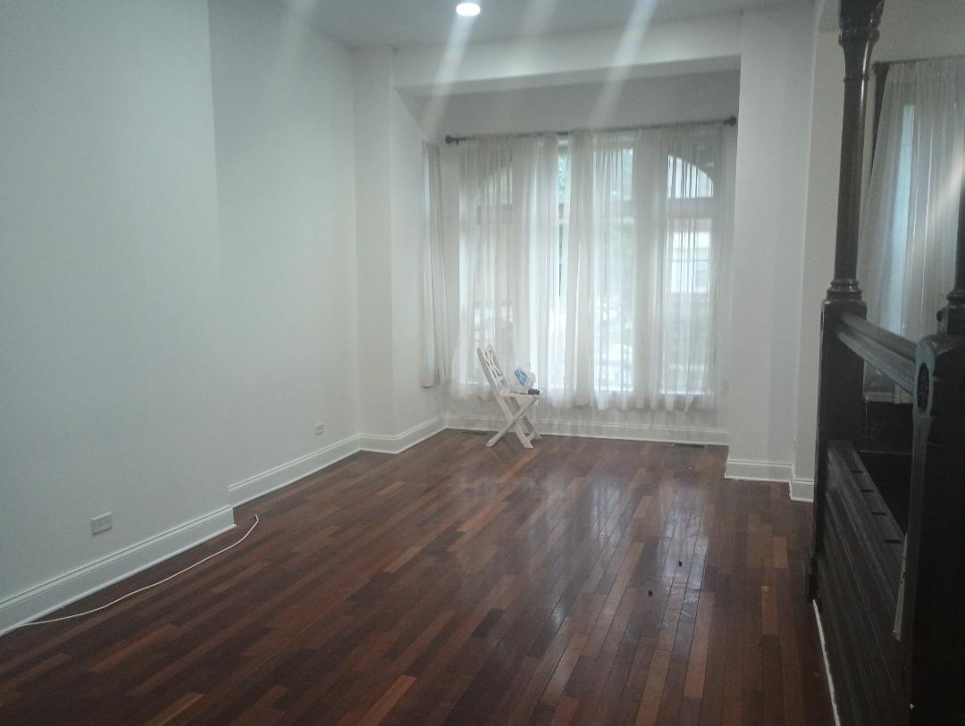 2236 West Monroe Street Chicago, IL 60612 - Photo 22 of 36 a view of an empty room with wooden floor and a window
