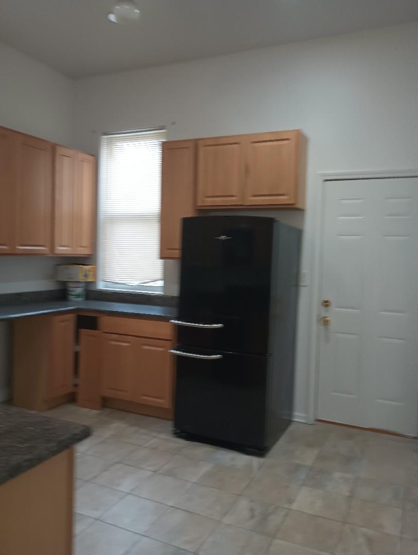 2236 West Monroe Street Chicago, IL 60612 - Photo 32 of 36 a kitchen with granite countertop a refrigerator and a sink