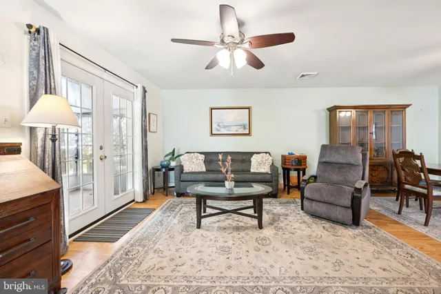 a living room with furniture and a rug