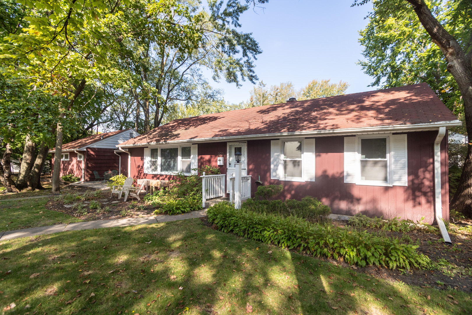 a front view of a house with garden