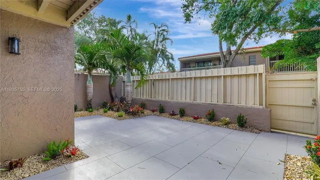 a bathroom with a tub sink shower and mirror