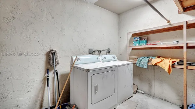 a kitchen with granite countertop cabinets and oven