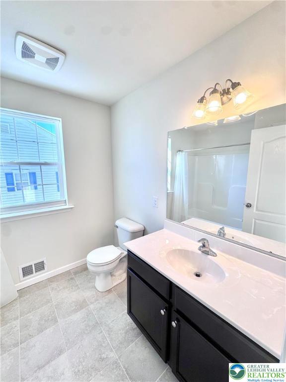 370 Redclover Lane Allentown, PA 18104 - Photo 18 of 33 a bathroom with a sink vanity and a toilet