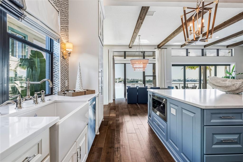 459 20th Avenue Indian Rocks Beach, FL 33785 - Photo 19 of 70 a kitchen with granite countertop a sink stove and cabinets