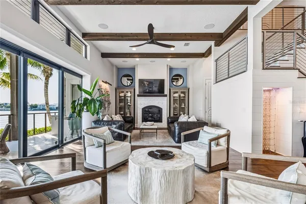 a living room with furniture and a kitchen