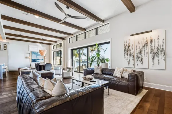 a bedroom with furniture and a large window