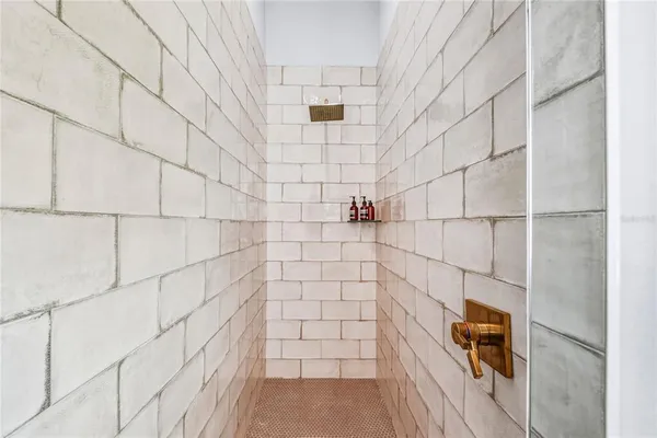 a bathroom with a sink a mirror and a light fixture