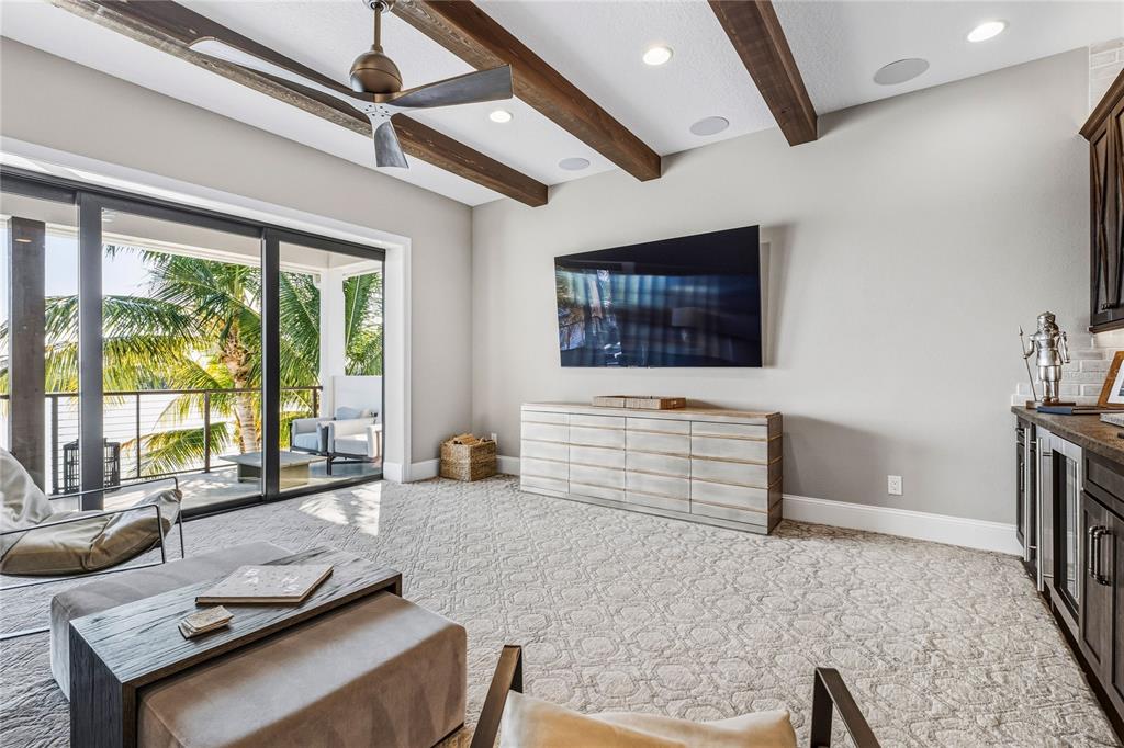 459 20th Avenue Indian Rocks Beach, FL 33785 - Photo 33 of 70 a living room with furniture and a flat screen tv