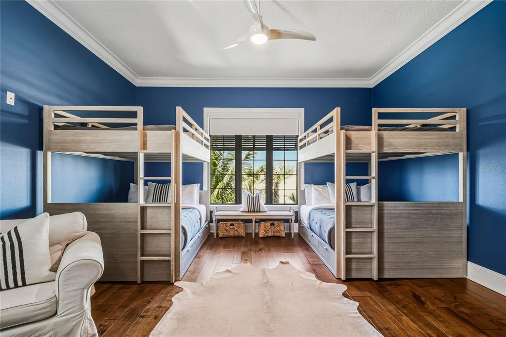 459 20th Avenue Indian Rocks Beach, FL 33785 - Photo 38 of 70 a bedroom with furniture and a large window