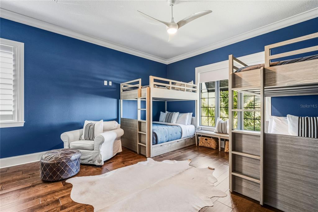 459 20th Avenue Indian Rocks Beach, FL 33785 - Photo 39 of 70 a bedroom with furniture and a large window