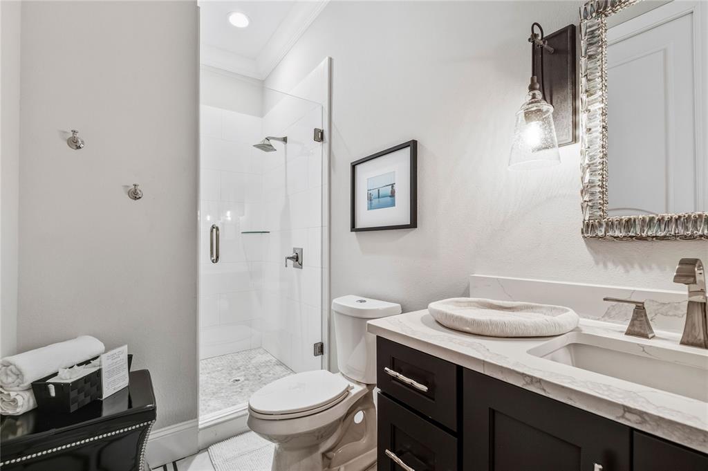459 20th Avenue Indian Rocks Beach, FL 33785 - Photo 43 of 70 a bathroom with a granite countertop sink a toilet and a mirror