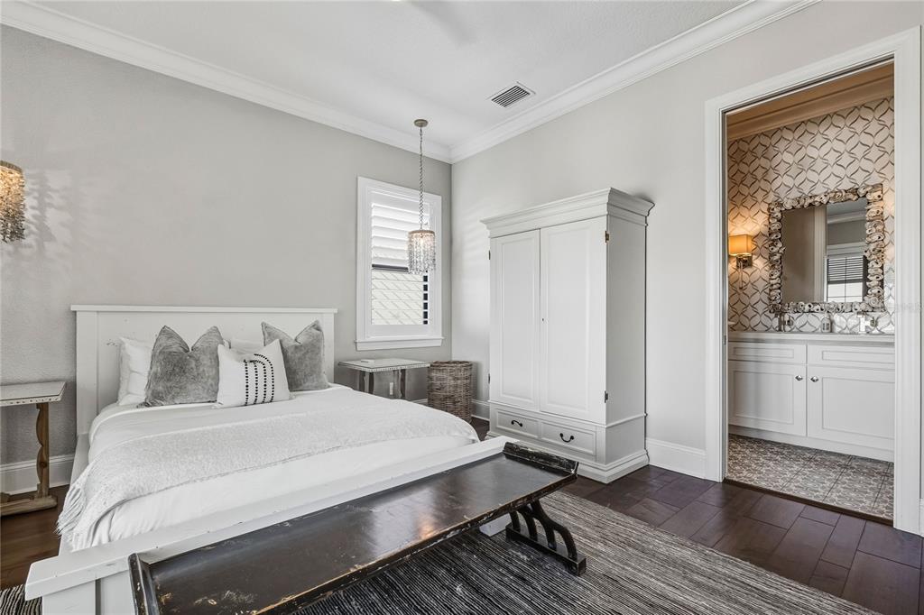 459 20th Avenue Indian Rocks Beach, FL 33785 - Photo 47 of 70 a bedroom with a bed and closet with wooden floor