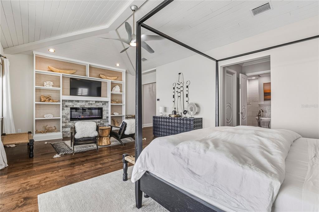 459 20th Avenue Indian Rocks Beach, FL 33785 - Photo 58 of 70 a spacious bedroom with a bed and a view of kitchen