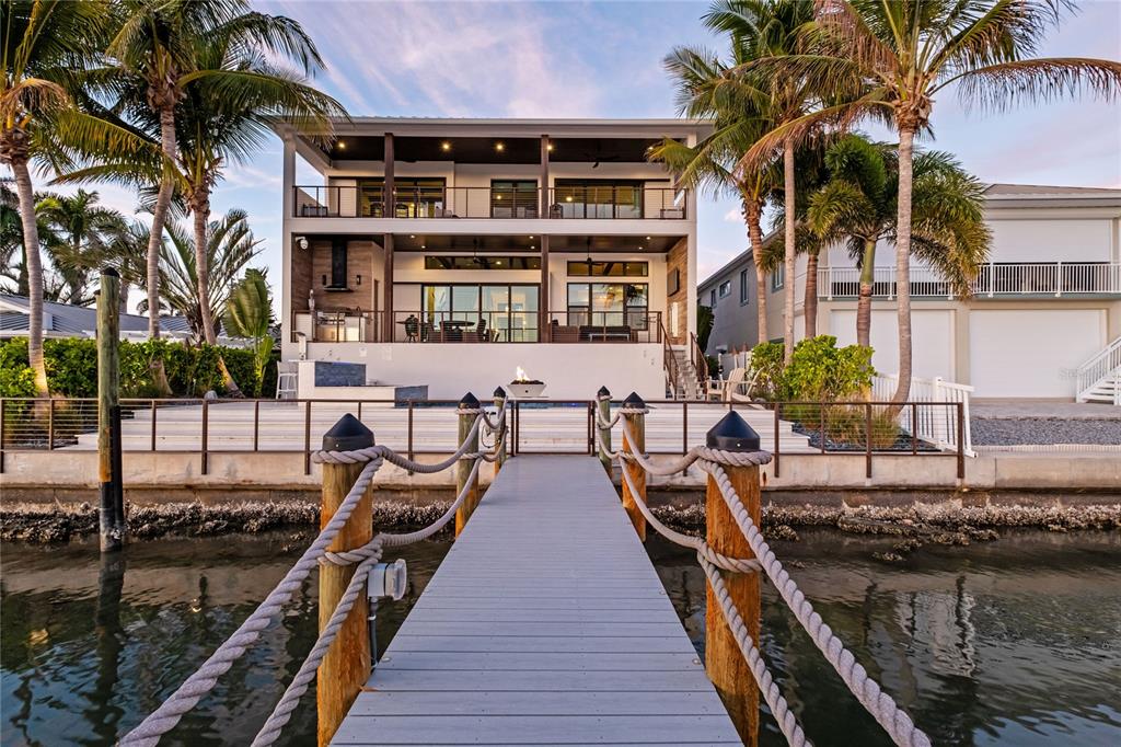 459 20th Avenue Indian Rocks Beach, FL 33785 - Photo 70 of 70 a view of a balcony with chairs and wooden floor