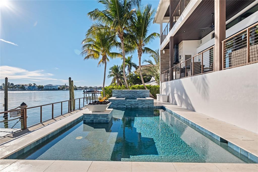 459 20th Avenue Indian Rocks Beach, FL 33785 - Photo 7 of 70 a view of a swimming pool with a lounge chair