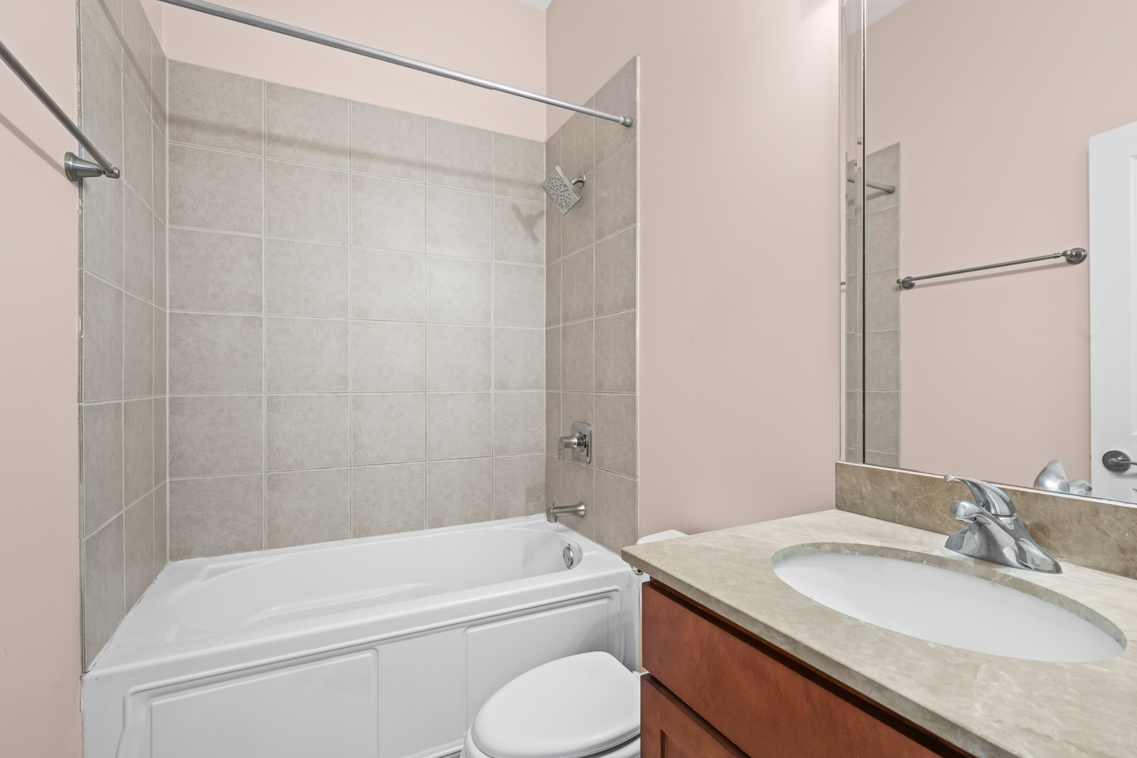 57 Northfield Terrace, Unit 57 Wheeling, IL 60090 - Photo 11 of 16 a bathroom with a granite countertop sink toilet and shower