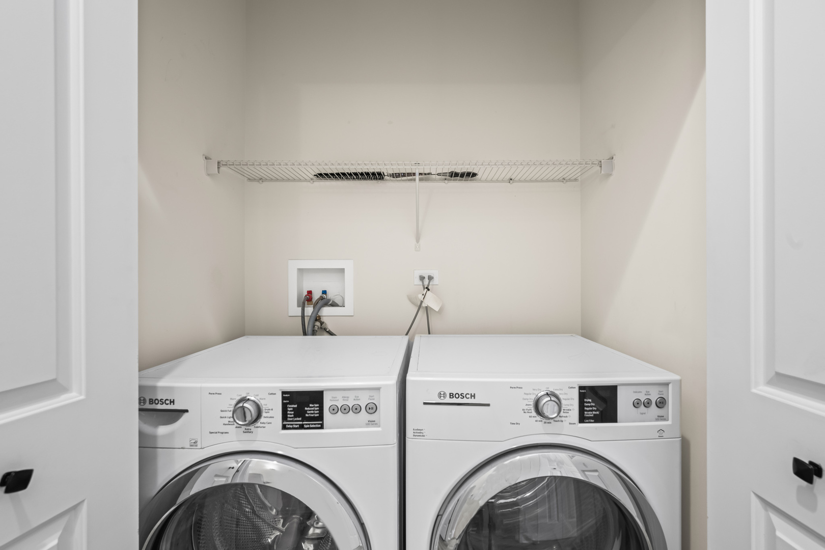 57 Northfield Terrace, Unit 57 Wheeling, IL 60090 - Photo 13 of 16 a utility room with dryer and washer