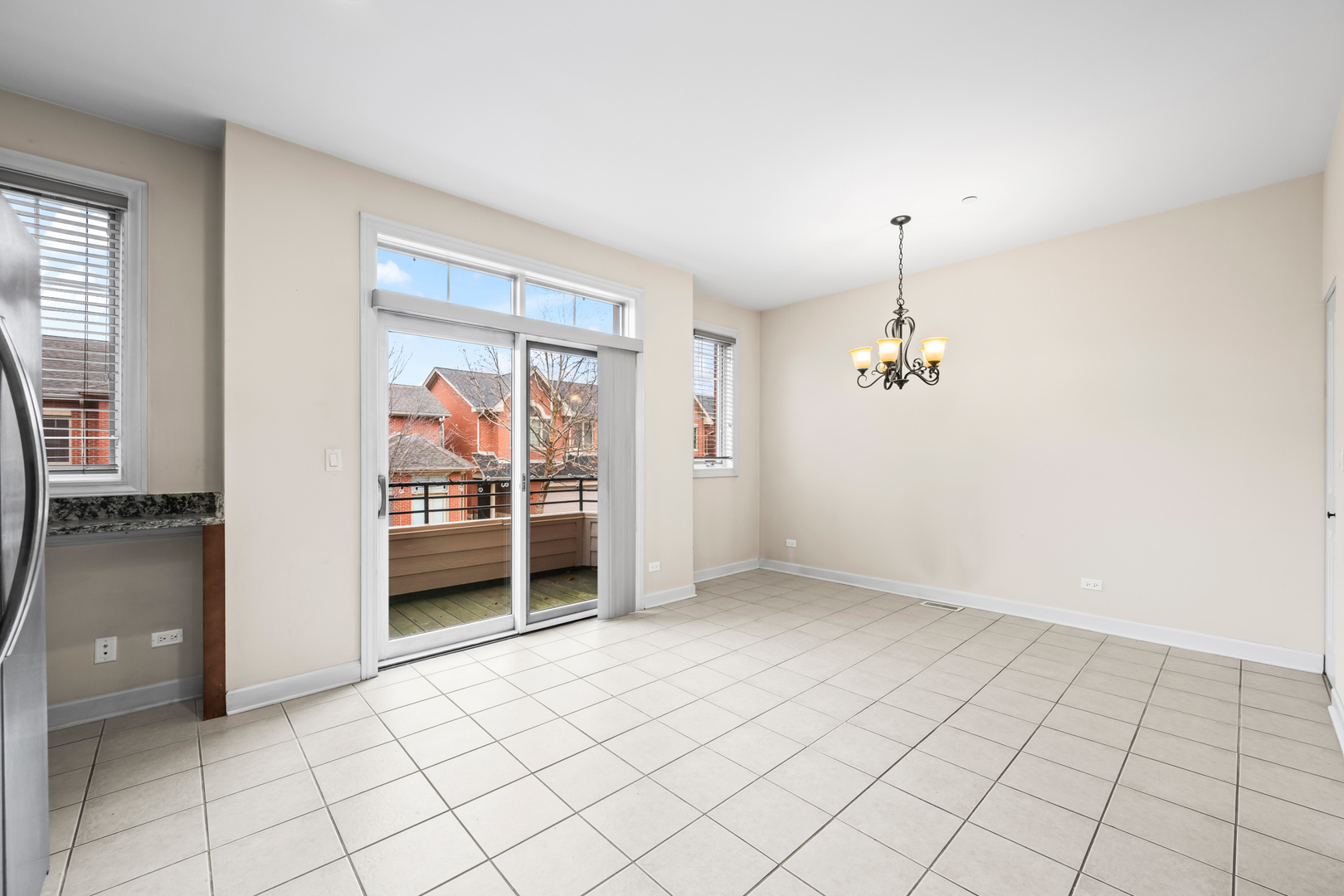 57 Northfield Terrace, Unit 57 Wheeling, IL 60090 - Photo 6 of 16 an empty room with windows