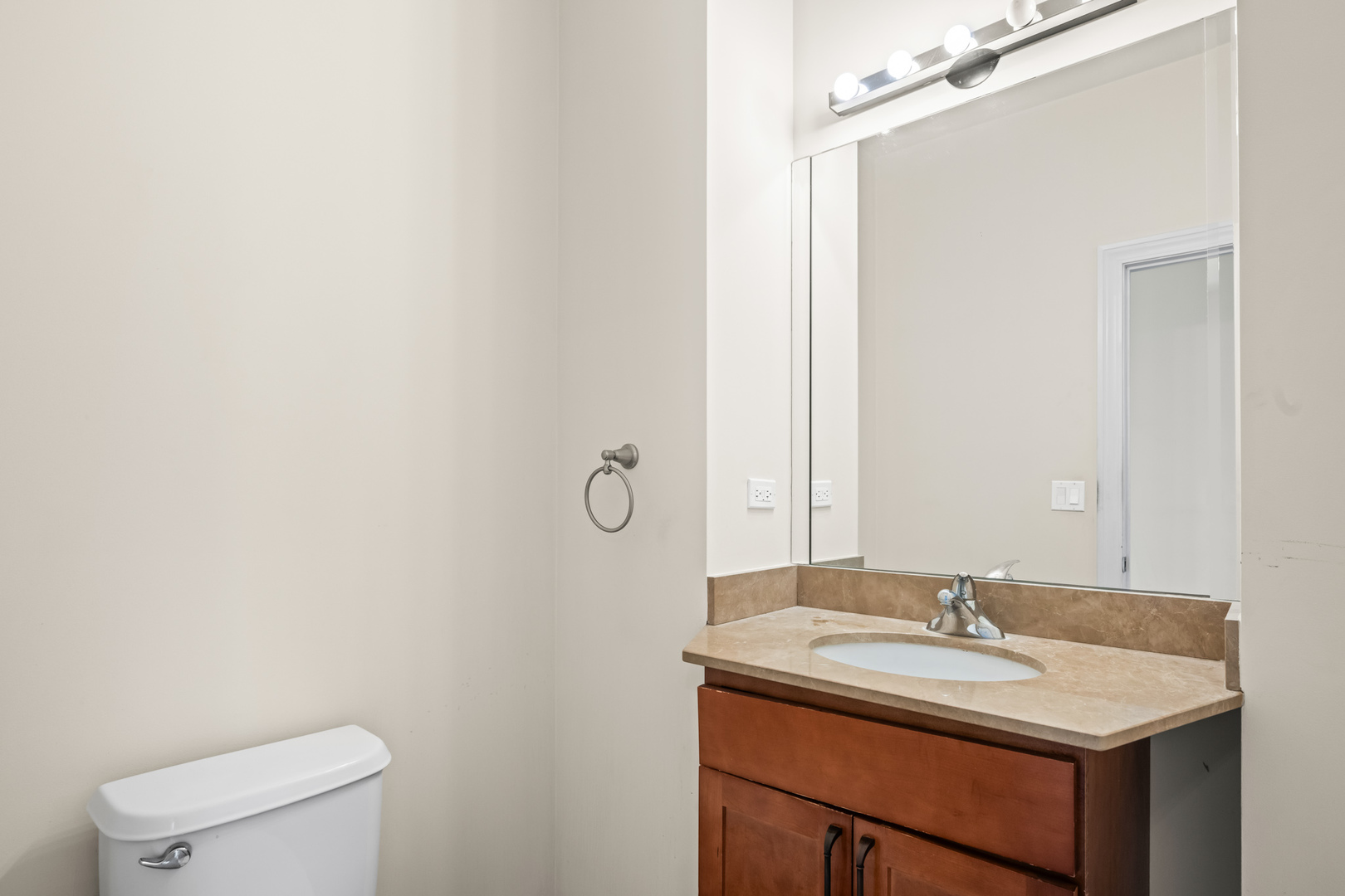 57 Northfield Terrace, Unit 57 Wheeling, IL 60090 - Photo 7 of 16 a bathroom with a sink and a toilet
