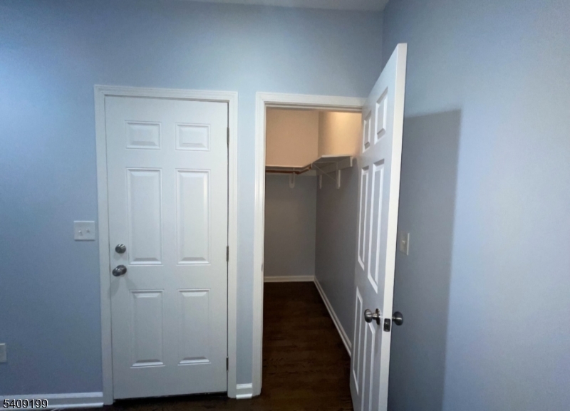 1519 Bower Street Linden, NJ 07036 - Photo 2 of 10 a view of a hallway with wooden floor and closet