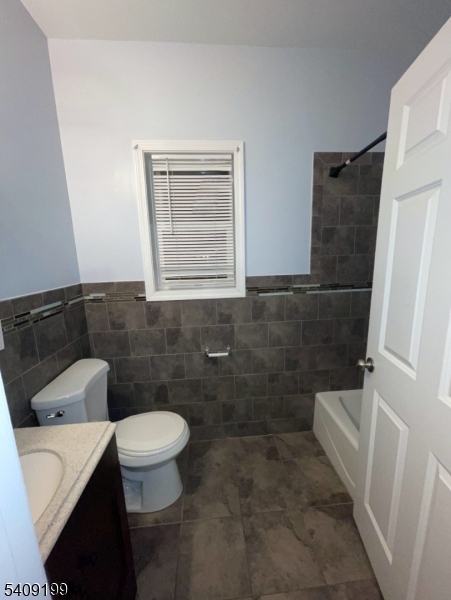 1519 Bower Street Linden, NJ 07036 - Photo 5 of 10 a bathroom with a sink a toilet and shower