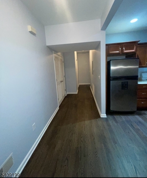1519 Bower Street Linden, NJ 07036 - Photo 10 of 10 a view of a hallway with wooden floor