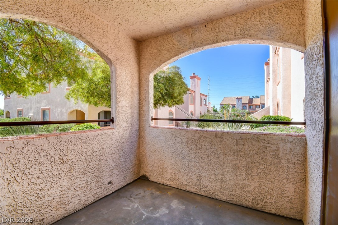 7570 West Flamingo Road, Unit 119 Las Vegas, NV 89147 - Photo 11 of 15 An inviting balcony offers serene community views and ample space for outdoor relaxation.