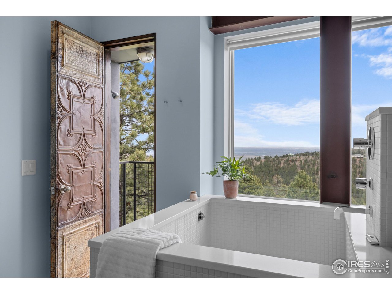 1440 Reed Ranch Road Boulder, CO 80302 - Photo 11 of 40 The outdoor shower is accessible directly from the primary bath. Views for days!