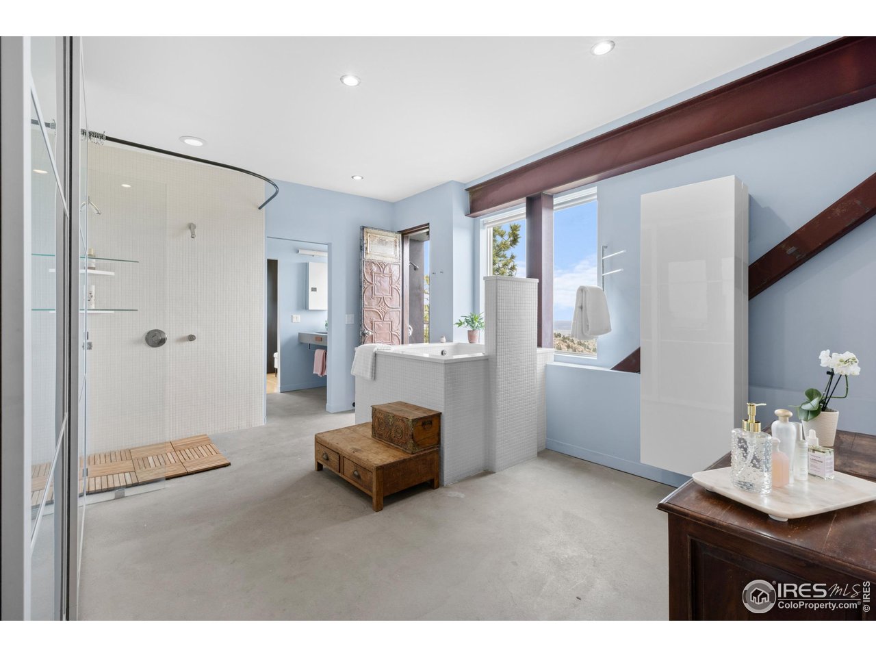 1440 Reed Ranch Road Boulder, CO 80302 - Photo 10 of 40 Primary bath with shower, Japanese soaking tub, and outdoor shower overlooking the meadow and city below.