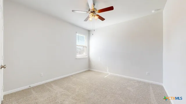 a view of a chandelier fan in a room
