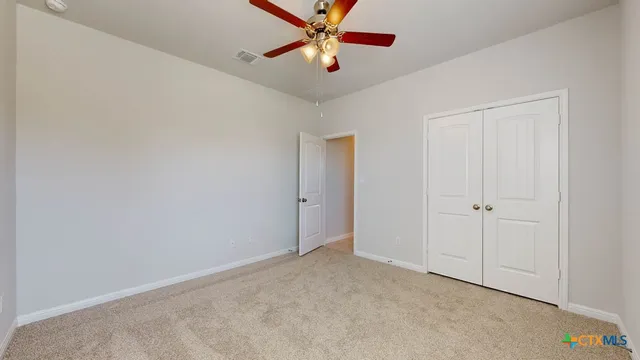 a bathroom with a granite countertop sink mirror and a bathtub